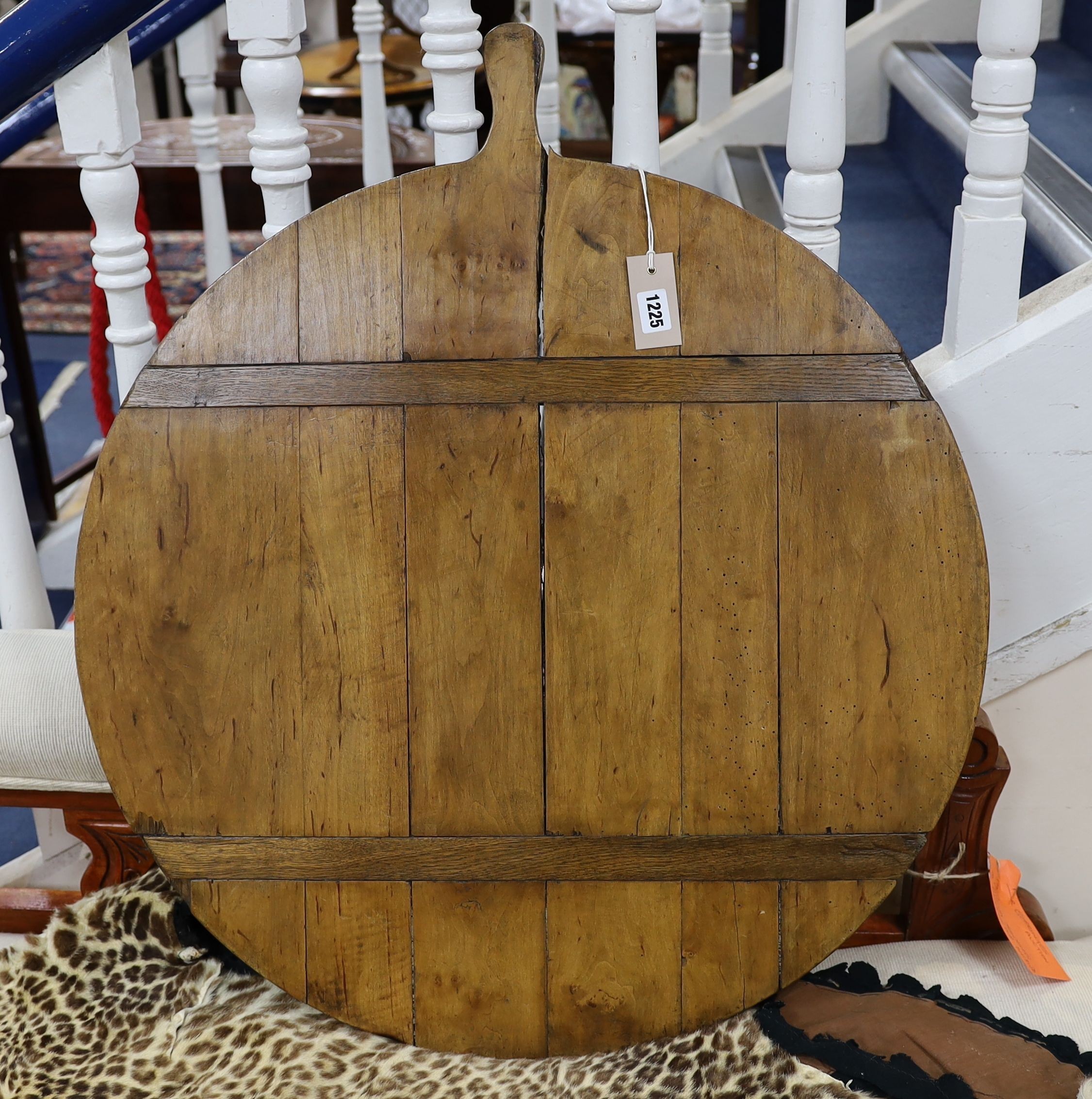 A 19th century fruitwood cheeseboard, diameter 71cm